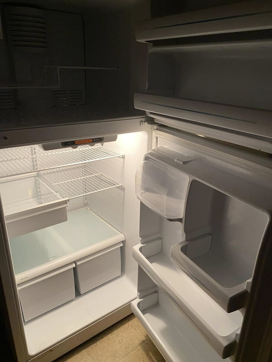 Empty refrigerator cleaned for a move out