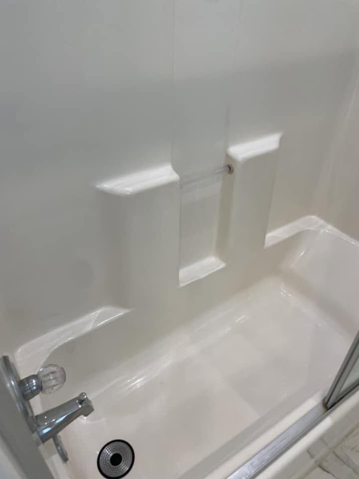 Clean white tub and shower surround